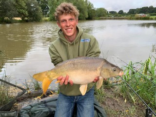 Young man with carp