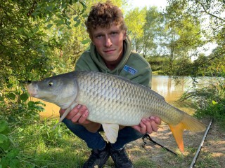 Young man with carp 11