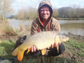 The fishing warden with a carp 2