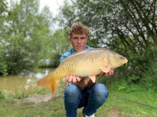 Young man with carp 3