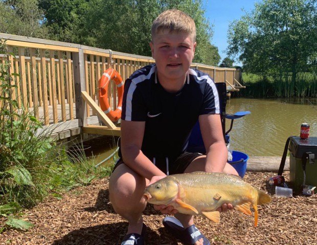 Young man with carp 7