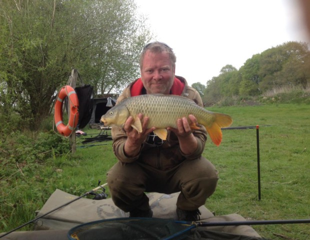 The fishing warden with a carp 3