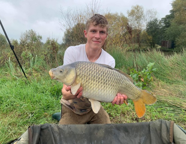 Young man with carp 8