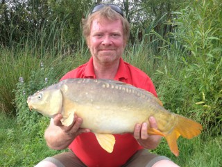The fishing warden with a carp